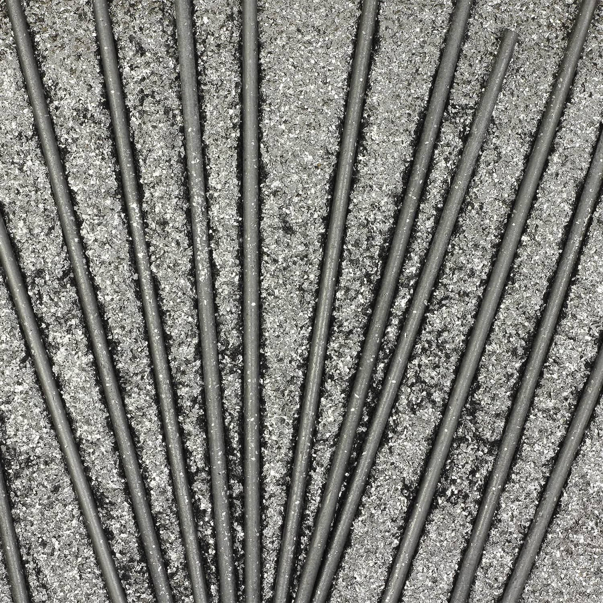 Multiple graphite cylinder stirring rods, dark gray sticks arranged in parallel