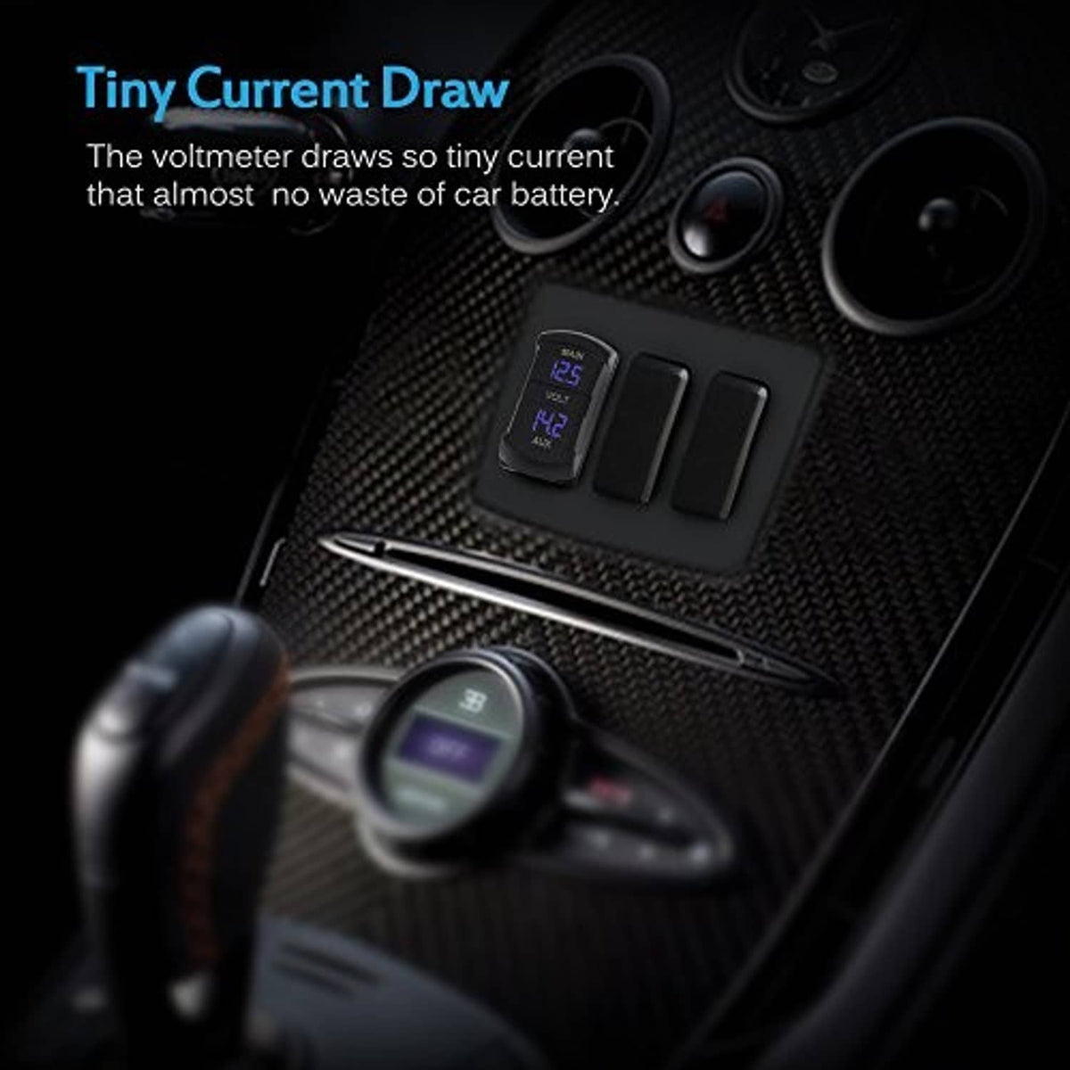 Compact black dual voltmeter with blue LED display mounted in dashboard switch panel