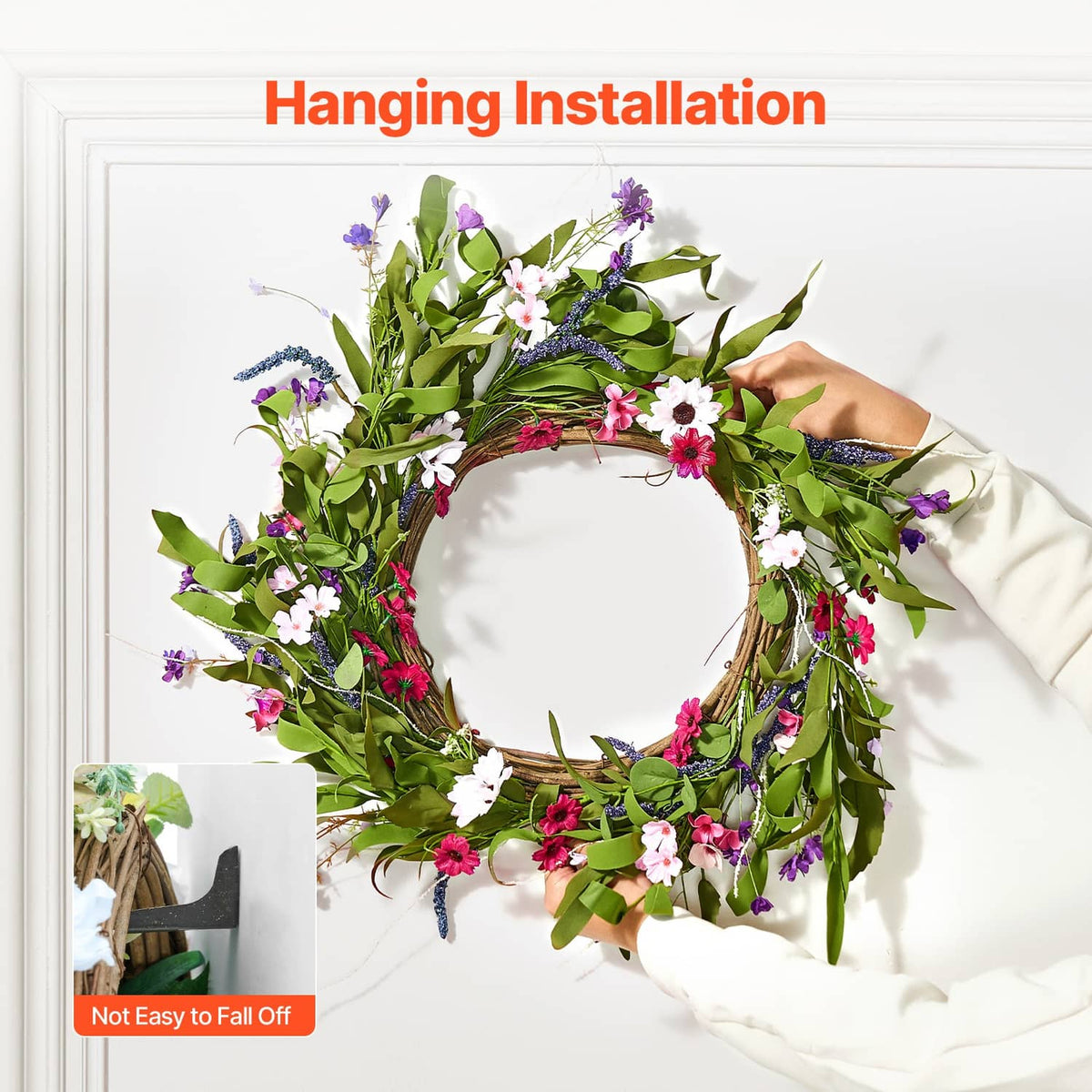 Artificial hanging wreath with green leaves and pink, white, purple flowers