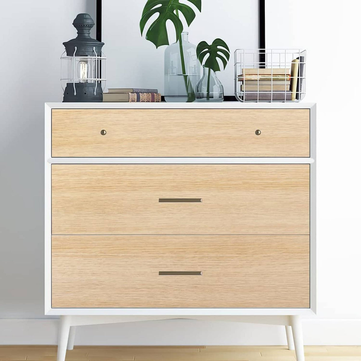Light oak woodgrain contact paper on a cabinet dresser with drawers