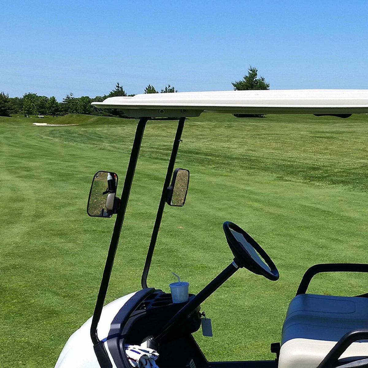 Golf cart side rear-view mirror mounted on black arm near front seat area