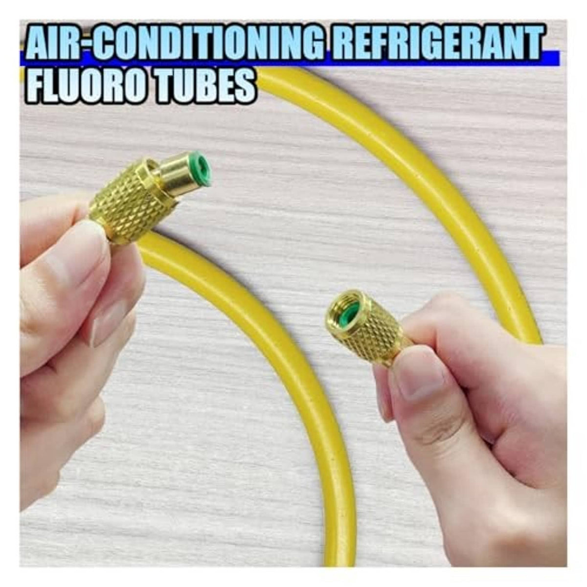 Yellow refrigerant hose with brass ends, held by hands