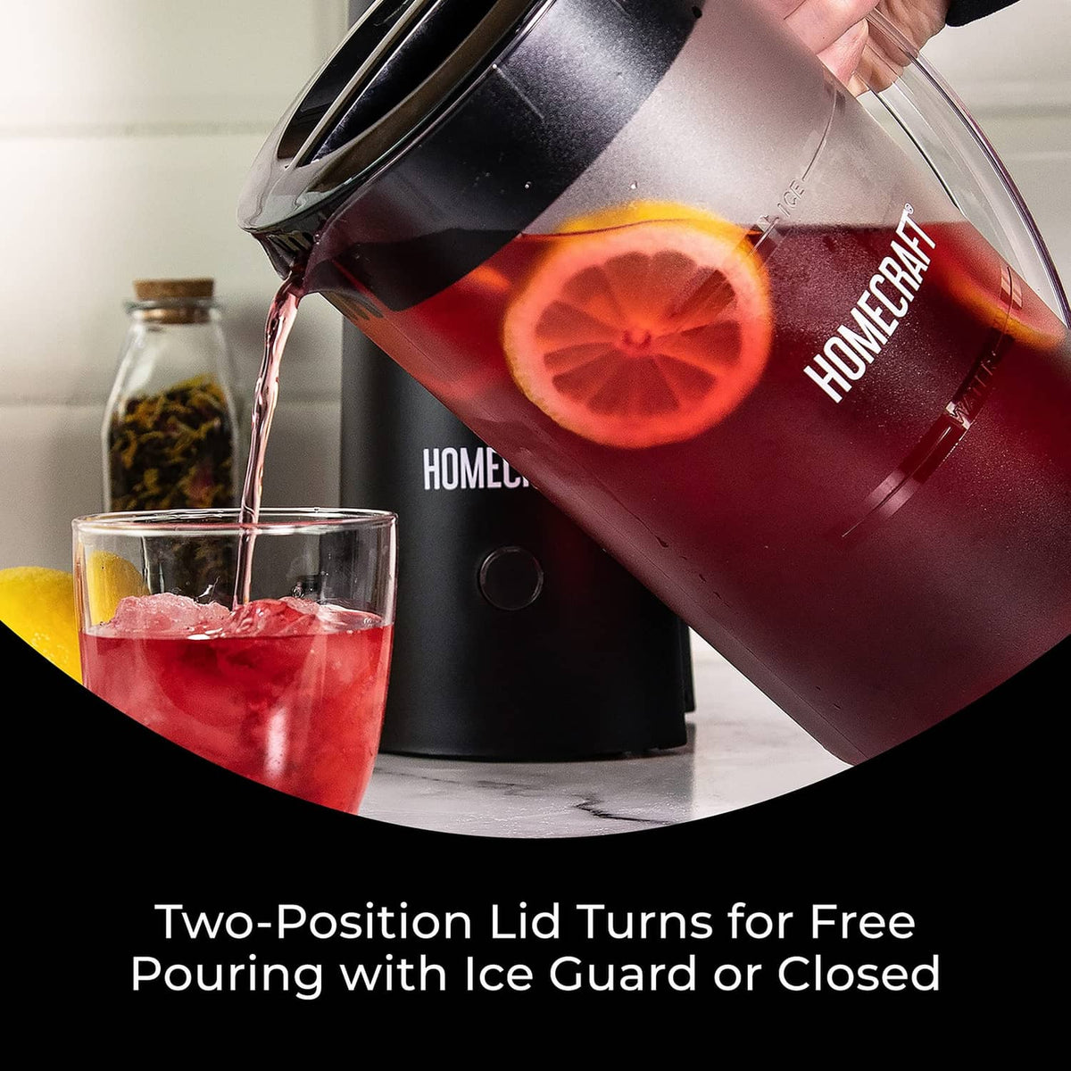 Black Homecraft iced tea maker pouring red tea into glass from clear pitcher