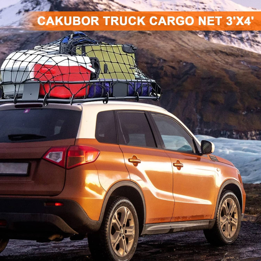Pickup truck bed cargo net stretched over cargo, black mesh grid with straps
