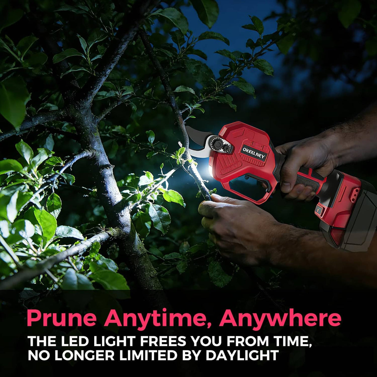 Red cordless pruning shears operating at night with LED light showing on the cutting area