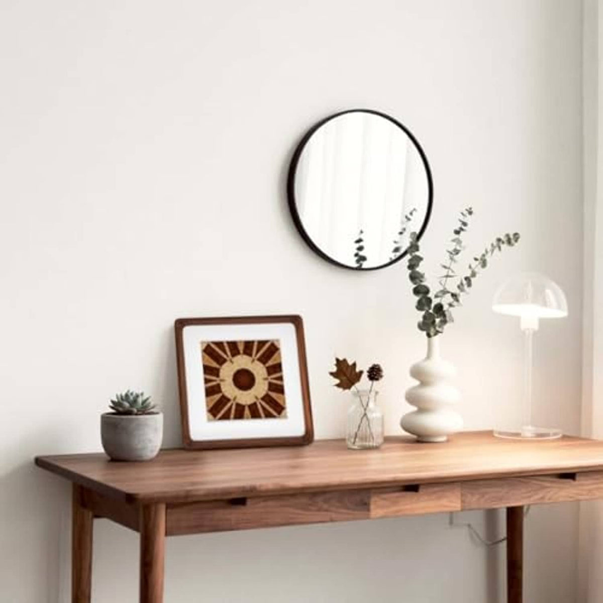 Set of walnut wood picture frames with white mats on a tabletop display.