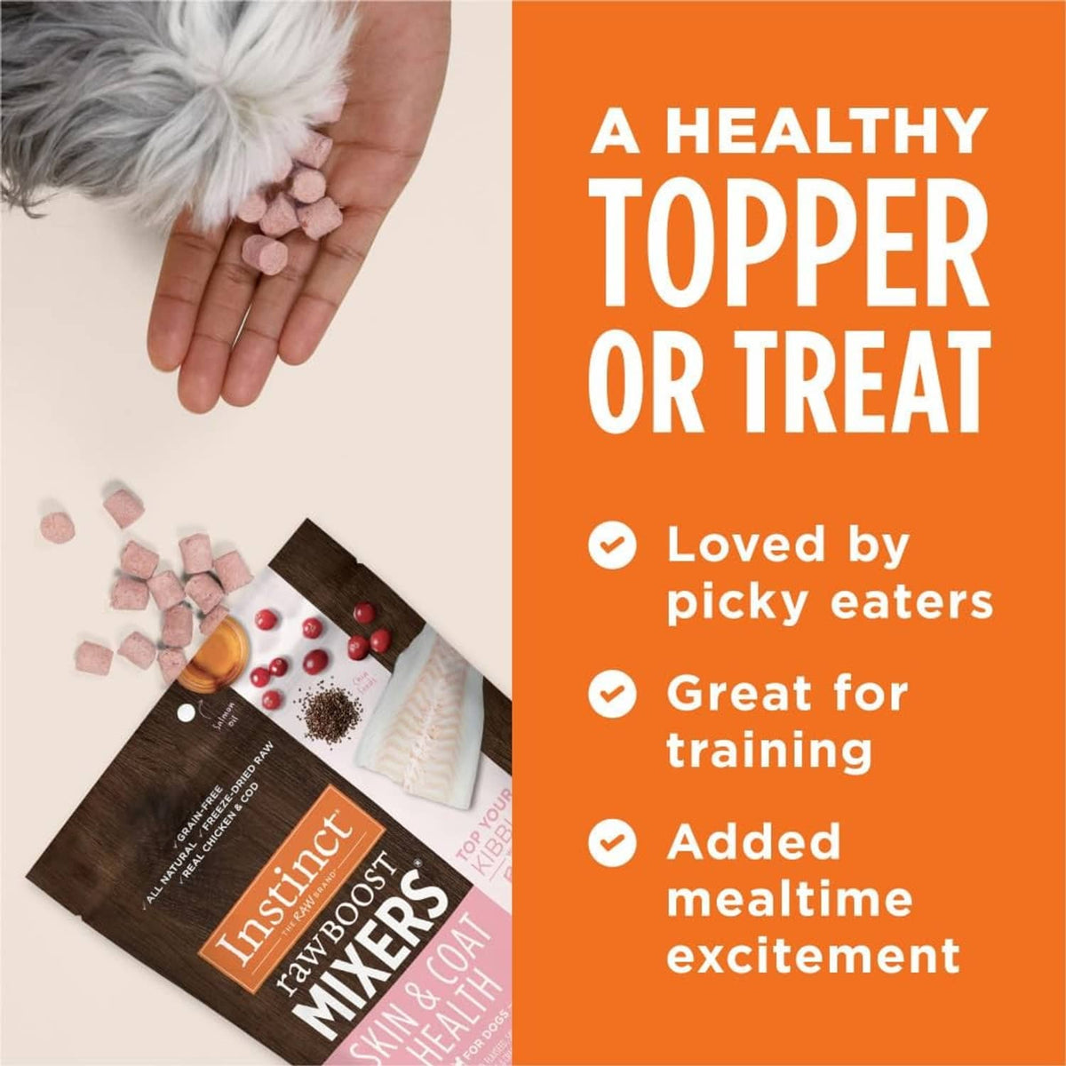 Dog food topper bites in a hand, with Instinct Raw Boost Mixers Skin & Coat Health pouch