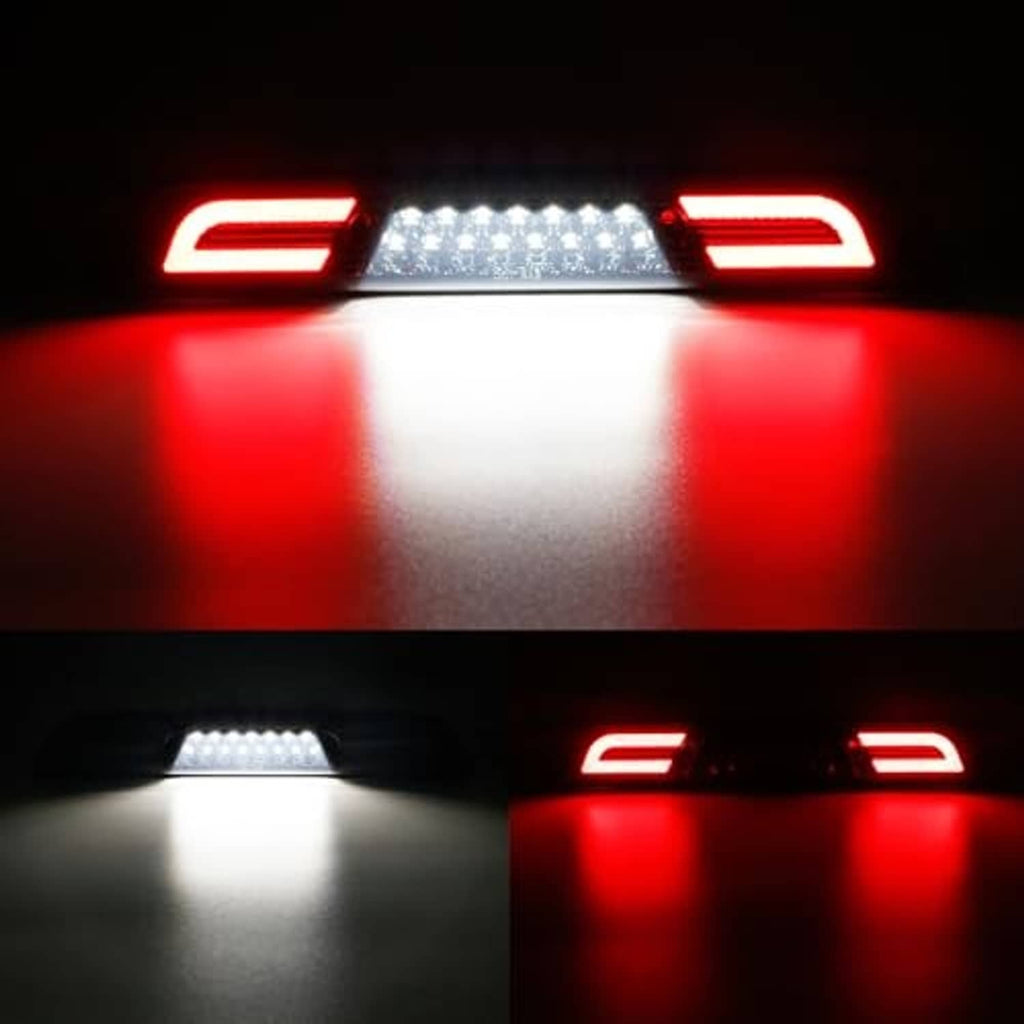 LED third brake light glowing red with white LED strip through smoky lens