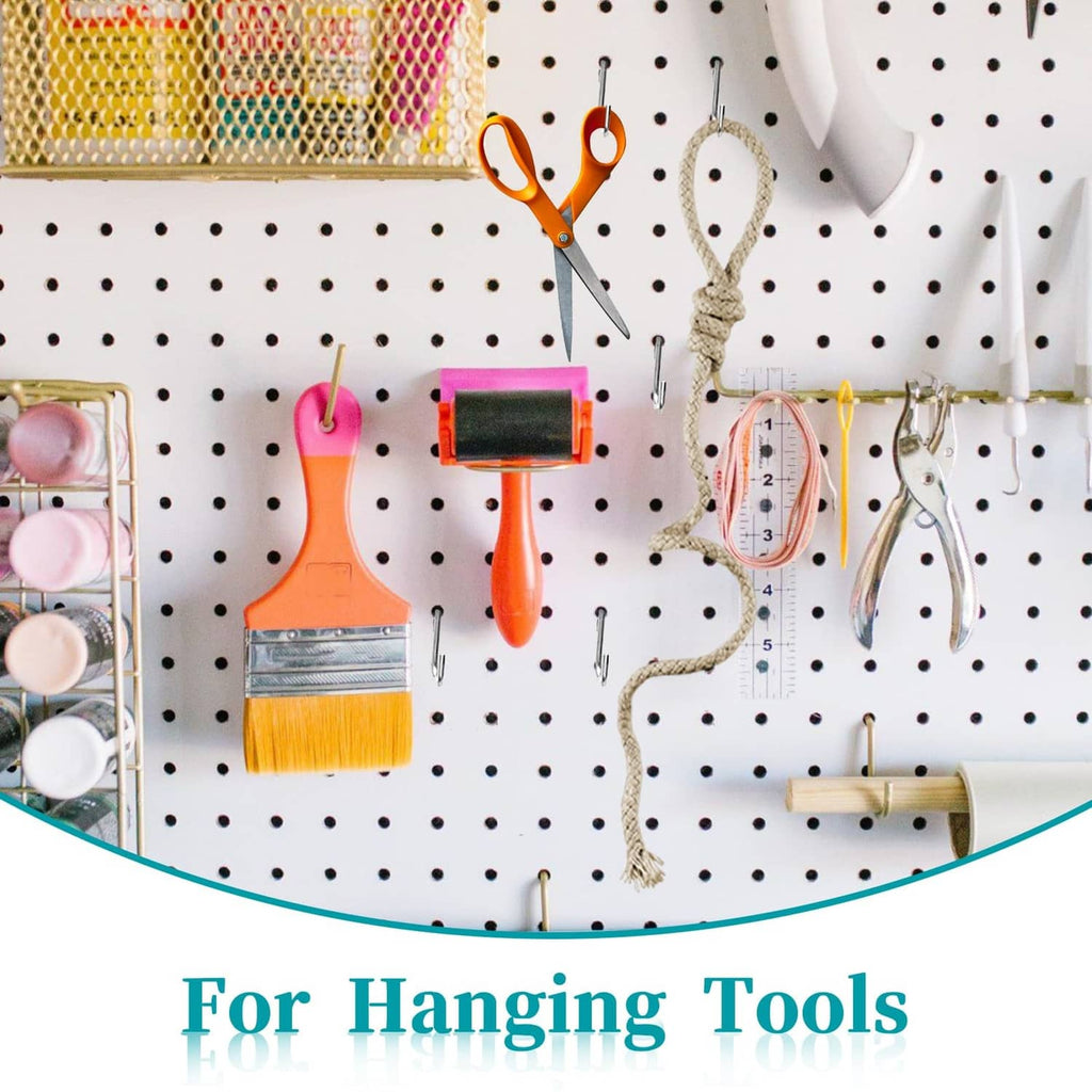 Metal S hooks on pegboard holding small tools like paint brushes