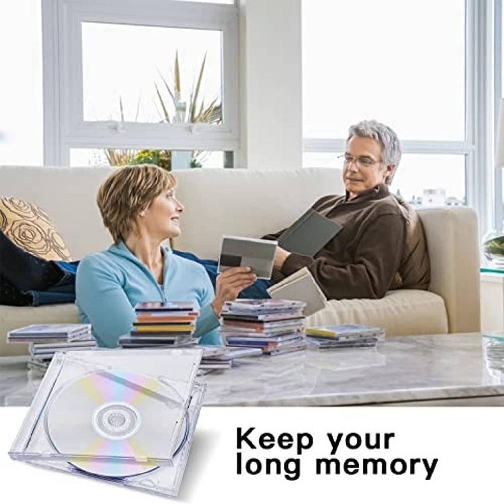 Clear single CD jewel case with disc in tray, placed on a table with spare cases