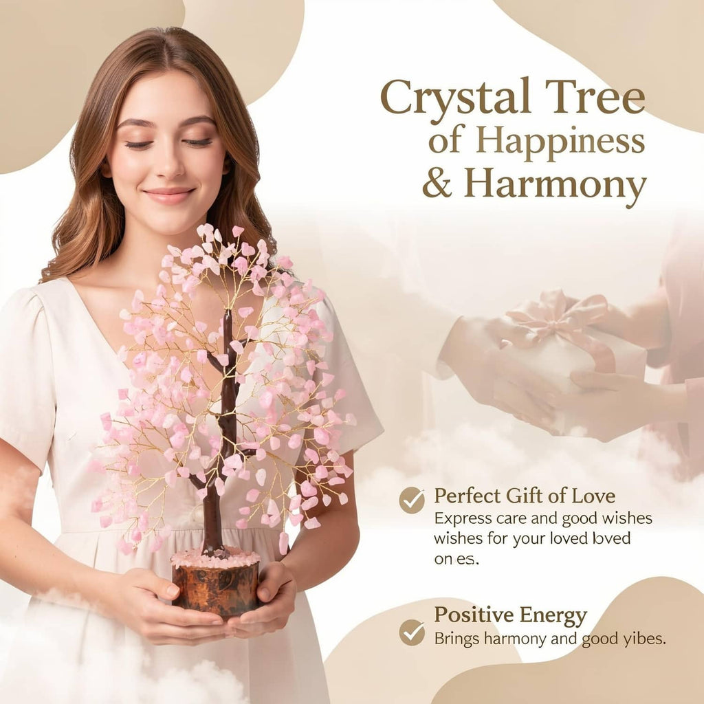 Rose quartz crystal tree with pink crystal branches held by a person, dark wood base