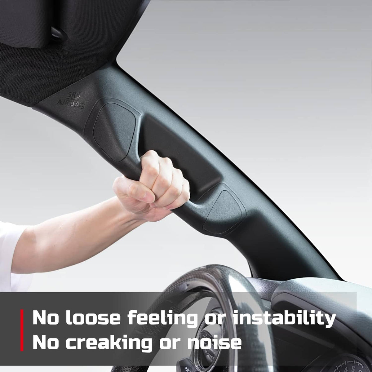 Hand adjusting a black A-pillar grab handle on the driver-side dash trim