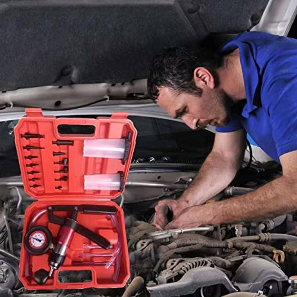 Brake bleeding tool kit open in red case, pressure gauge and pump used under hood