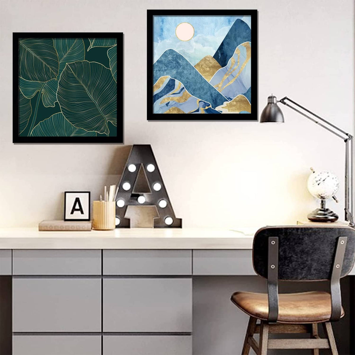 Black 13x13 picture frame holding abstract mountain and gold line artwork