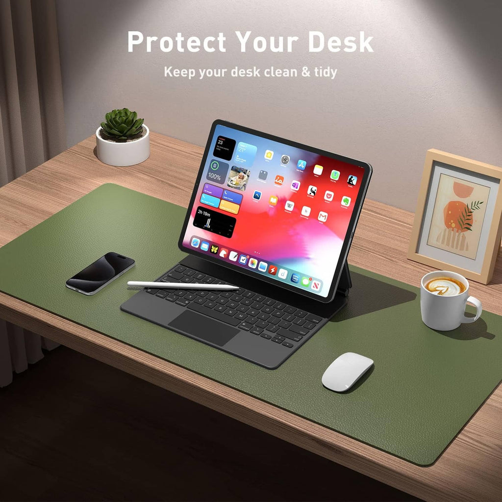 Olive green desk mat under laptop, mouse, and phone on a wooden desk