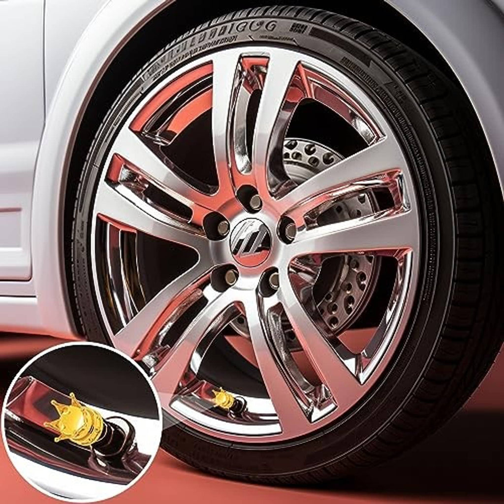 Gold crown tire valve stem cap set installed on a car wheel valve stem, with rubber seal