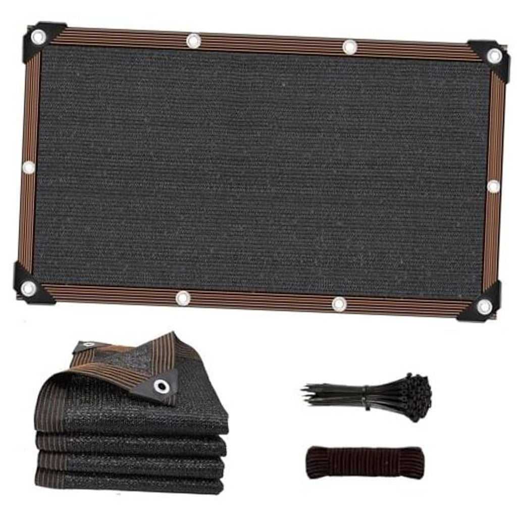 Black shade sail panel with metal grommets and brown reinforced edge straps