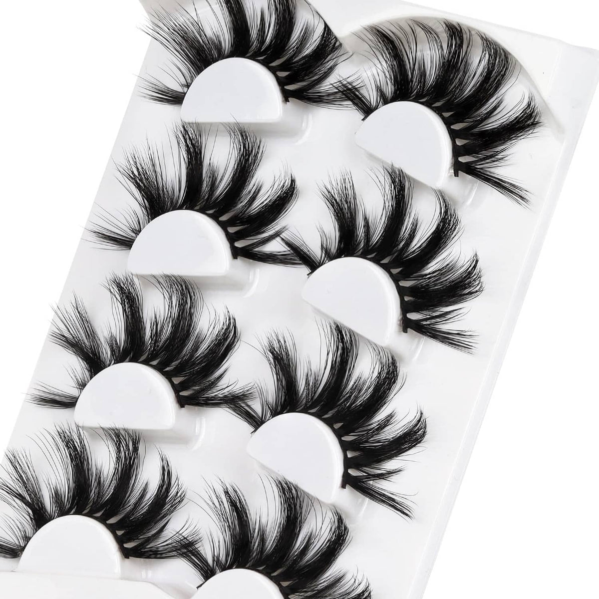 Close-up of faux mink eyelash fans with white lift bands, black lash fibers