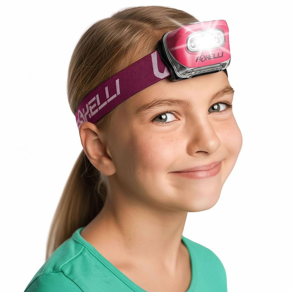 Neon pink LED headlamp with adjustable strap, worn on a child’s forehead