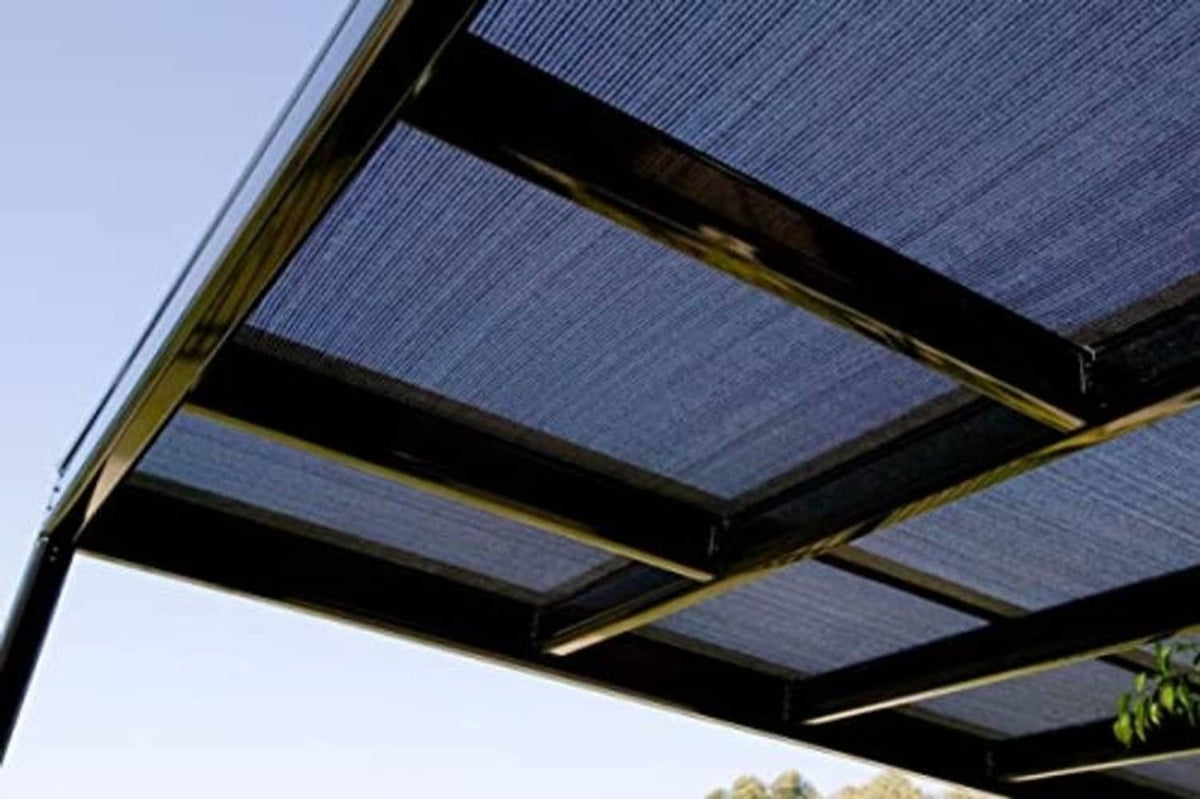 Black shade cloth panel laid over pergola roof beams
