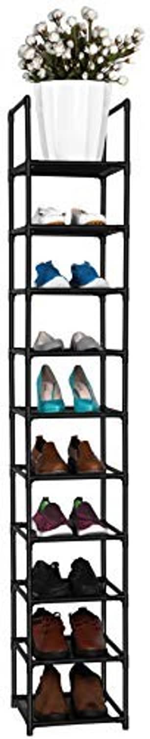 Black vertical shoe rack with open tiers holding shoes and a white planter on top