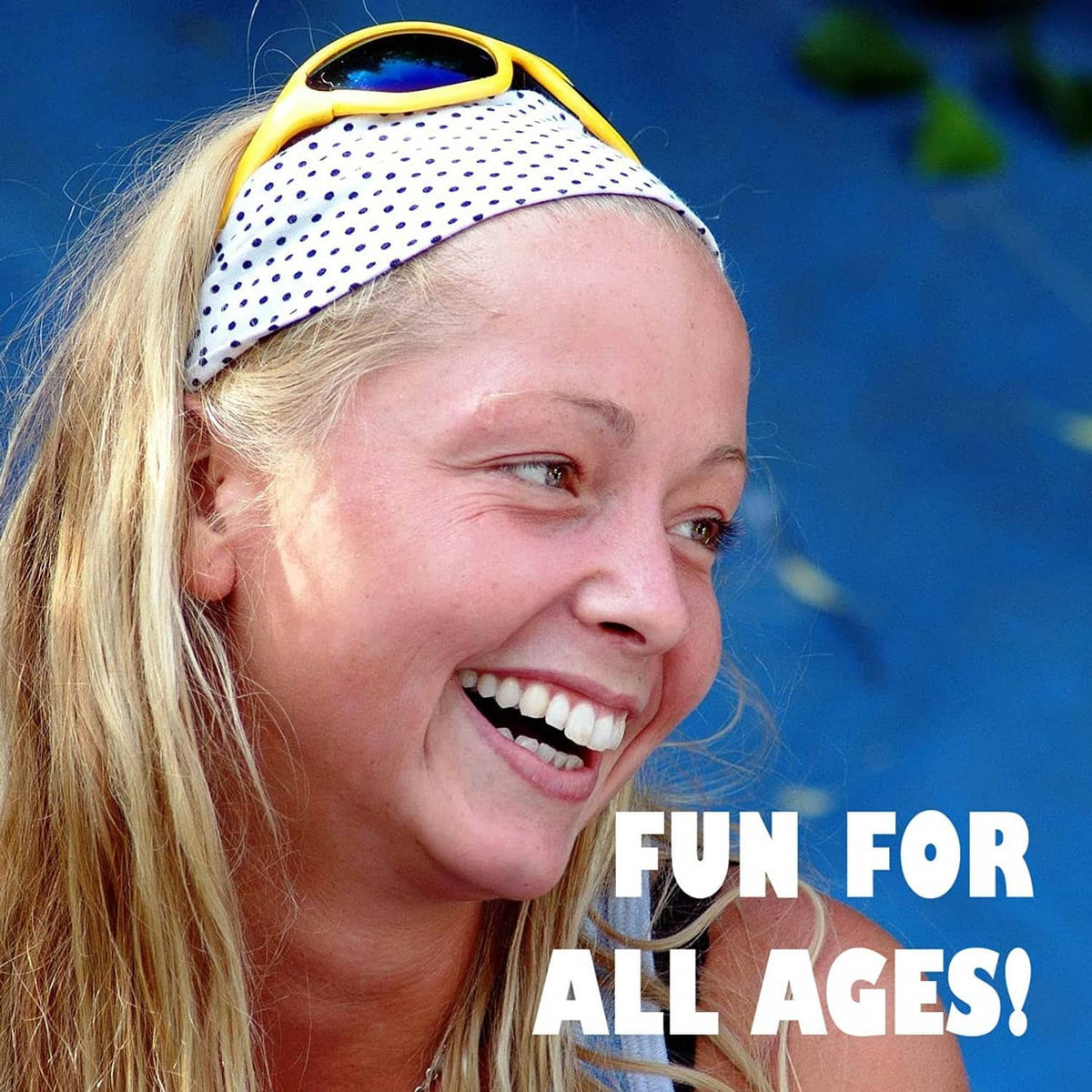 Laughing woman wearing a blue and white polka-dot headband