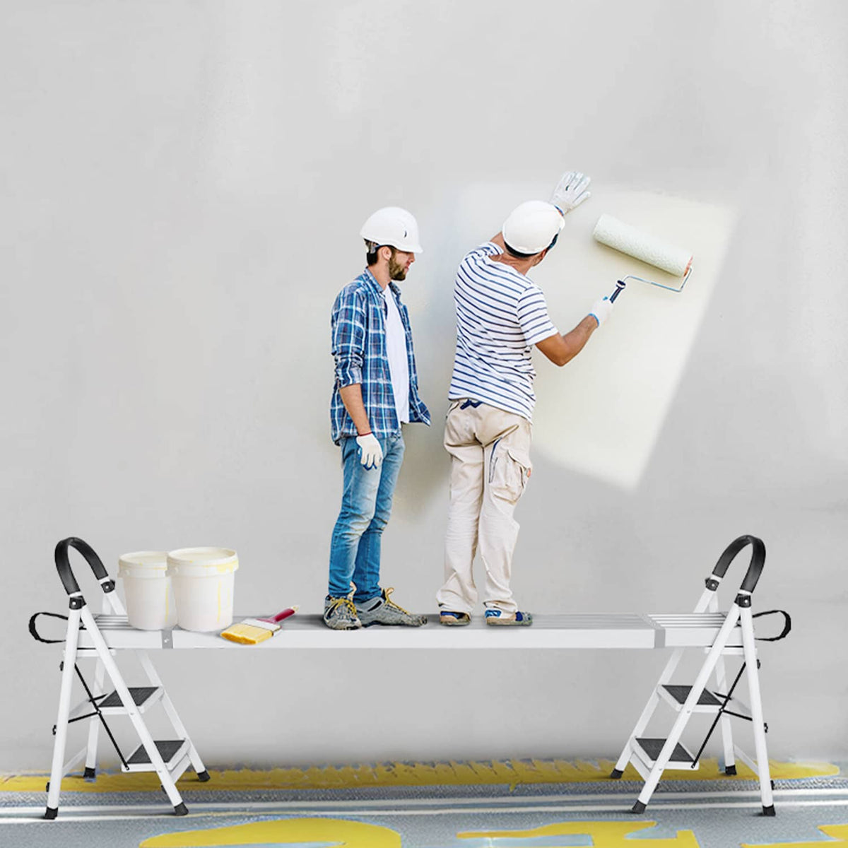 Aluminum scaffold plank set across two ladders with black strap handles