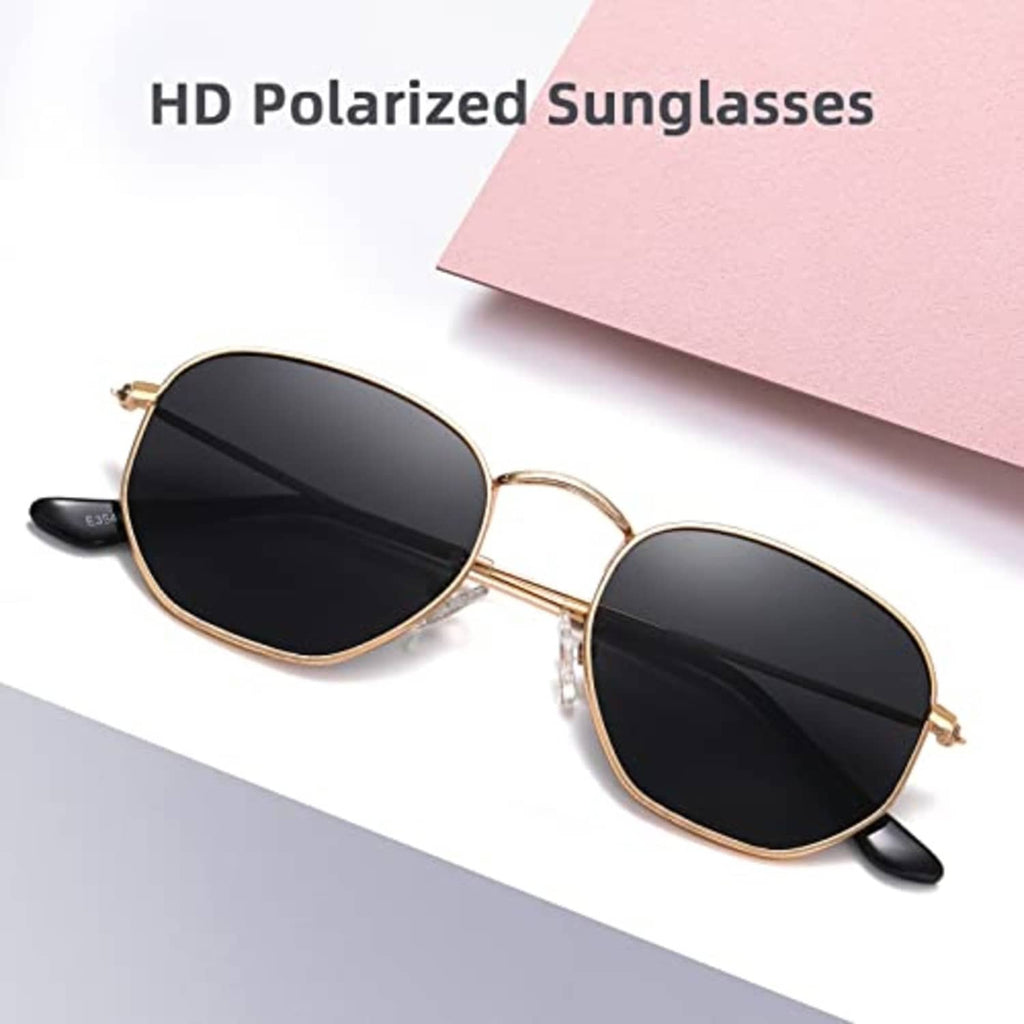 Gold hexagon sunglasses with dark lenses, thin metal rims, angled front view