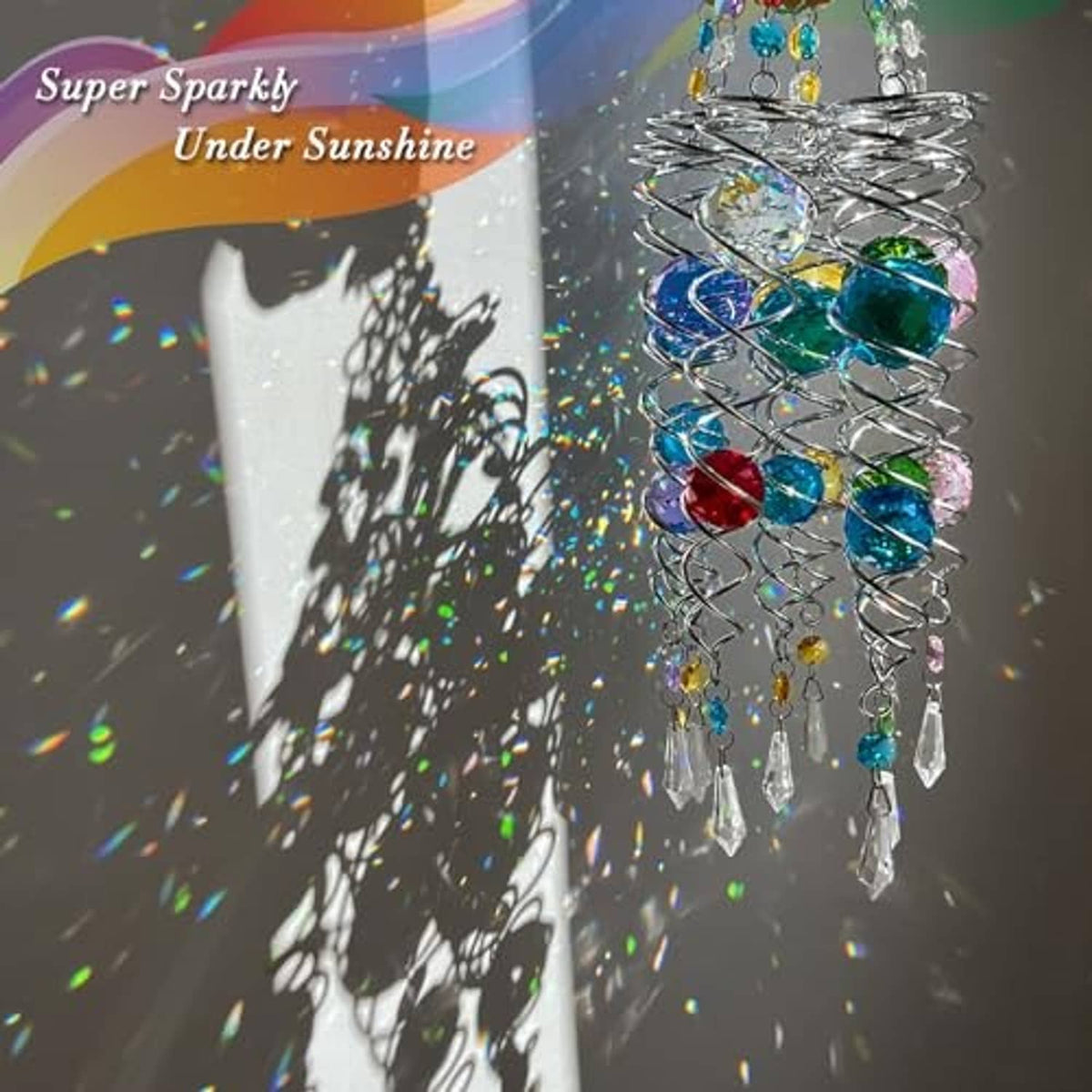 Butterfly wind spinner sun catcher with blue crystal spiral, gazing balls, and dangling charms