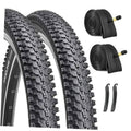 Mountain bike tires (2-pack) with deep black tread, close-up side view.