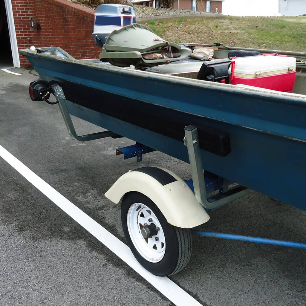 Boat trailer bunk board guide installed on teal rail with black guide blocks and silver posts
