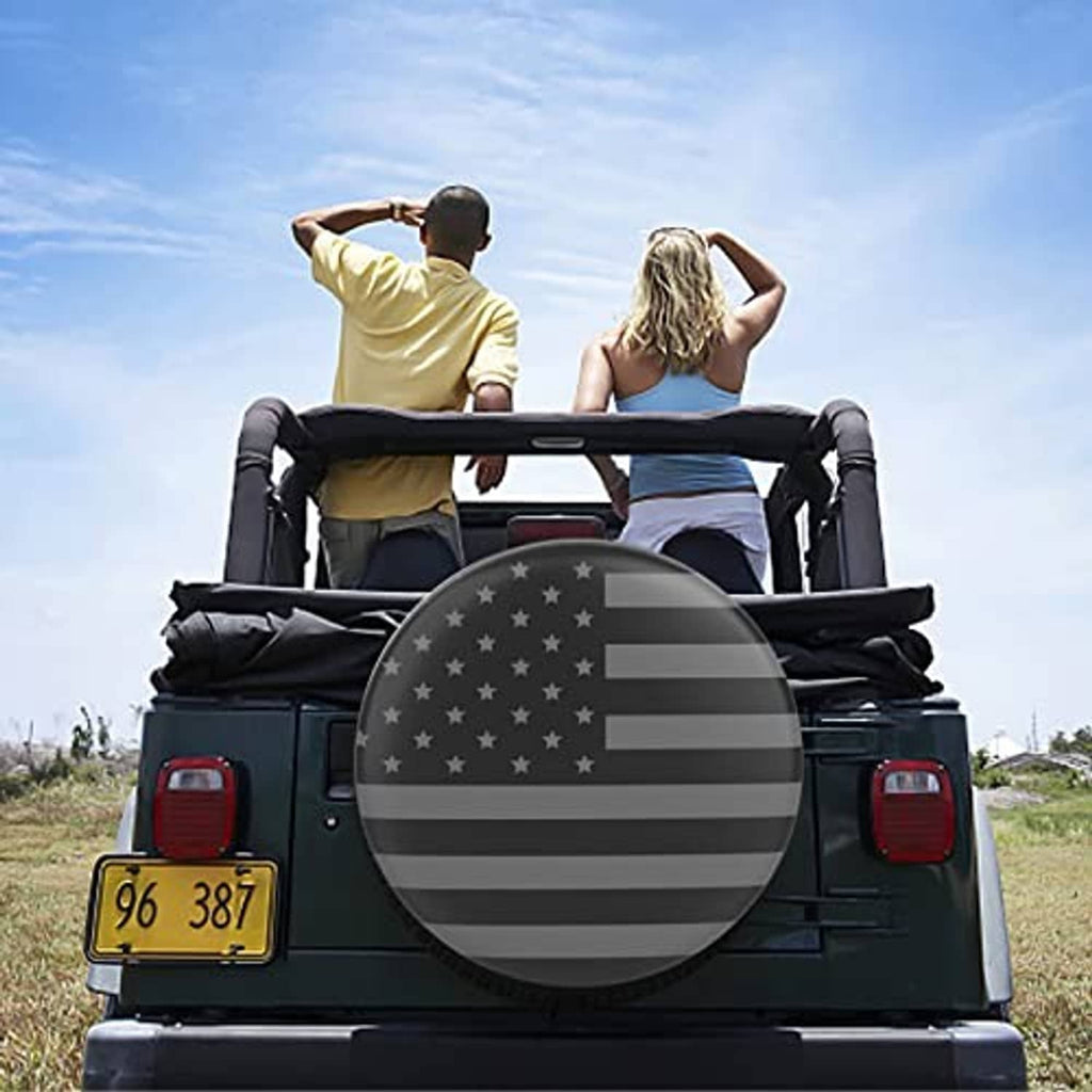 American flag spare tire cover on the back of an RV, round black cover