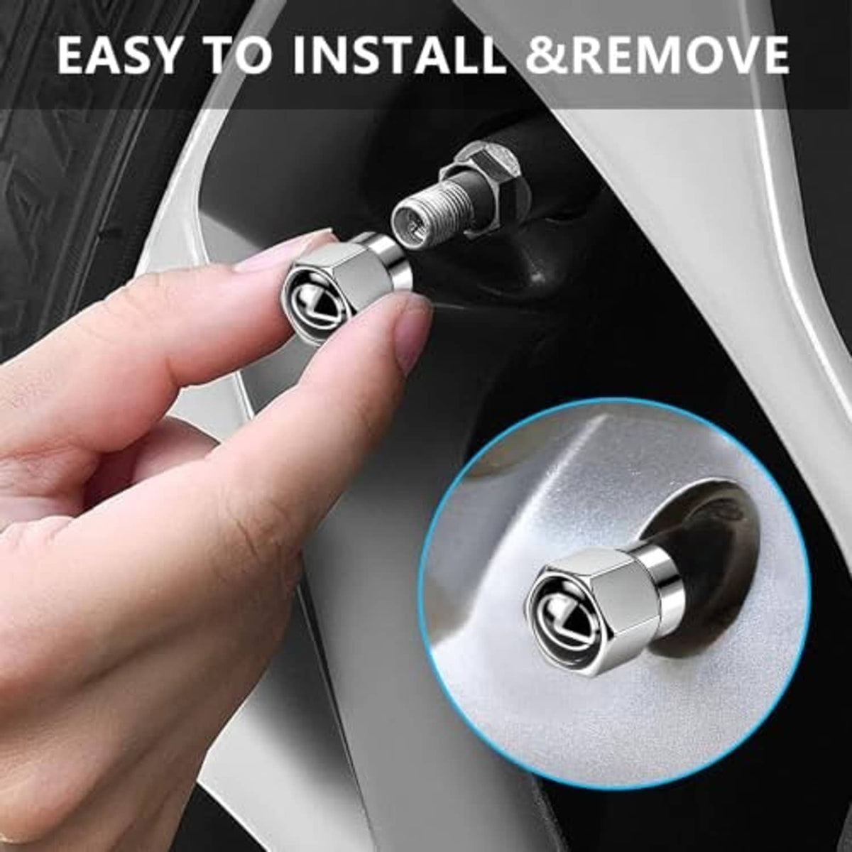 Chrome tire valve stem cap with black emblem, held by hand near wheel valve