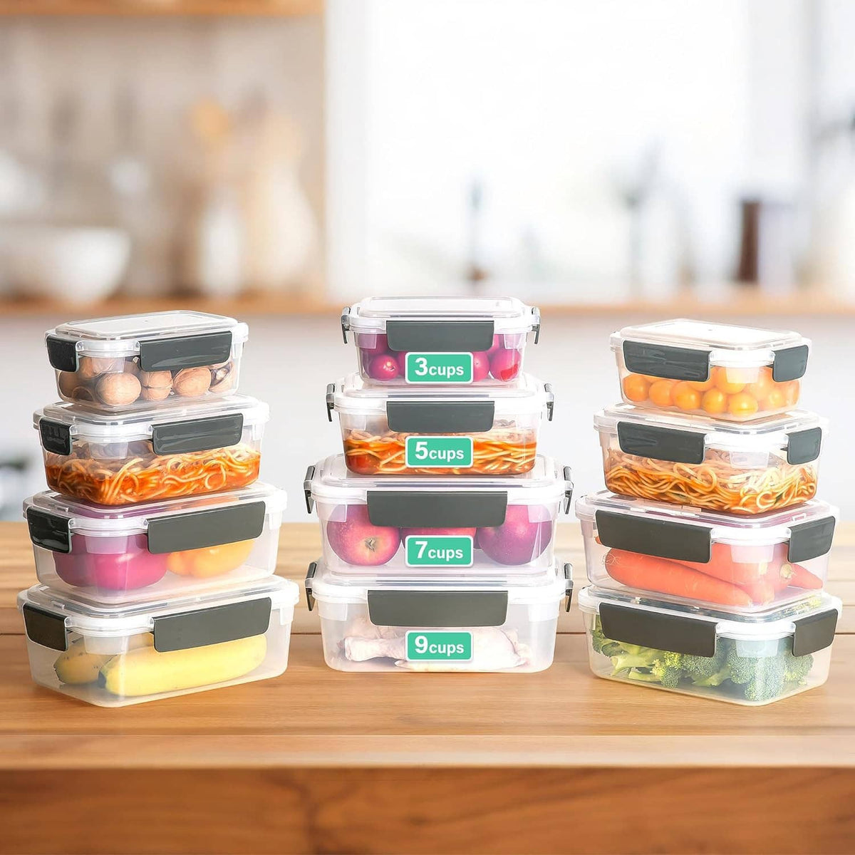 Clear plastic food storage containers with black latch lids, arranged with contents