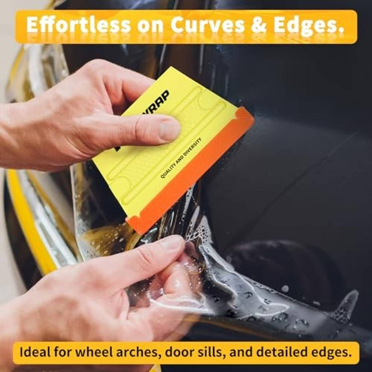 Hand using yellow trapezoid felt squeegee to smooth vinyl wrap on dark glass.