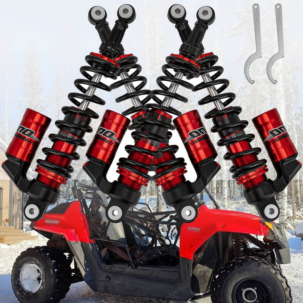 Air shock absorbers with red cylinders and black coil springs mounted on a red ATV