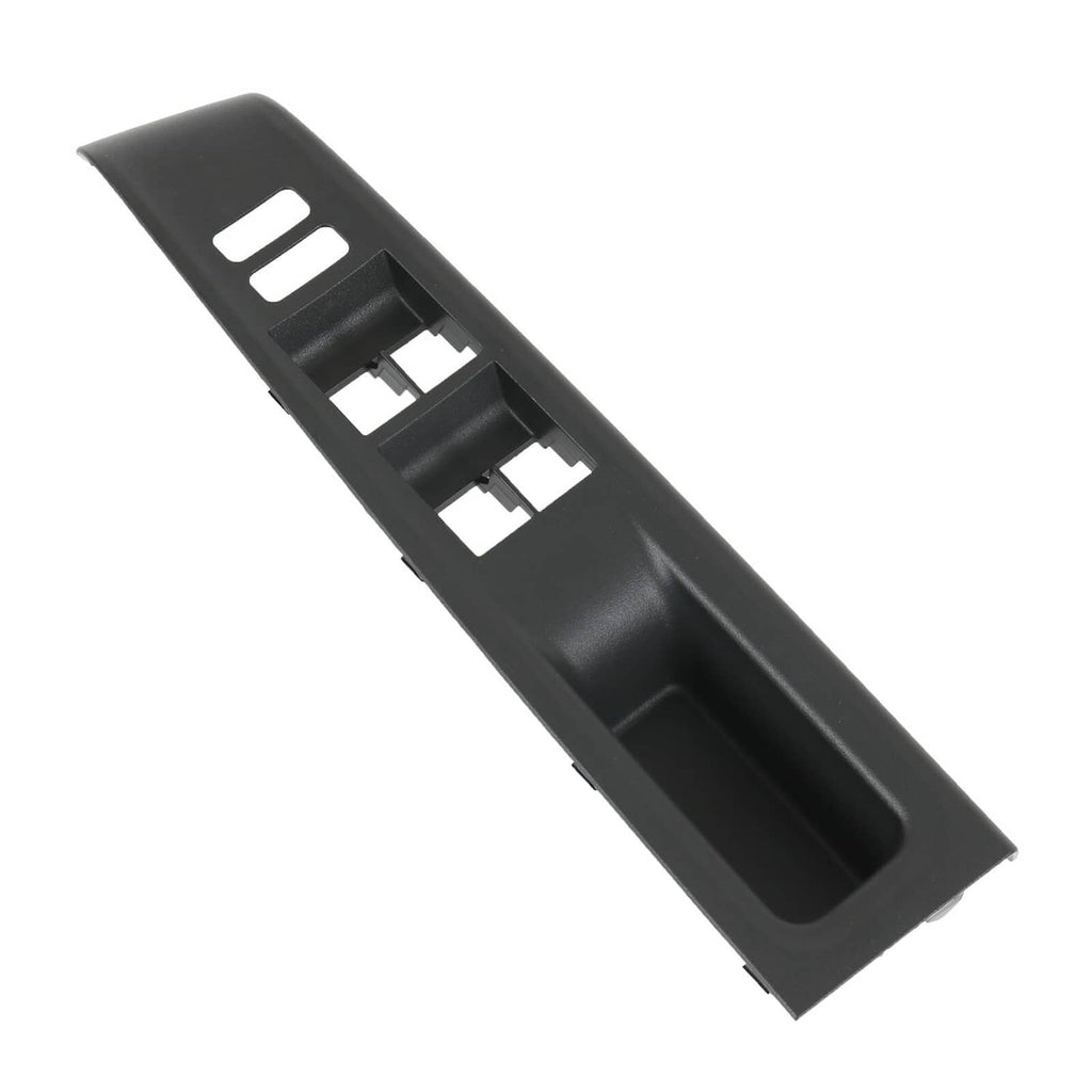 Left driver door window switch bezel trim cover, angled view, matte dark gray.