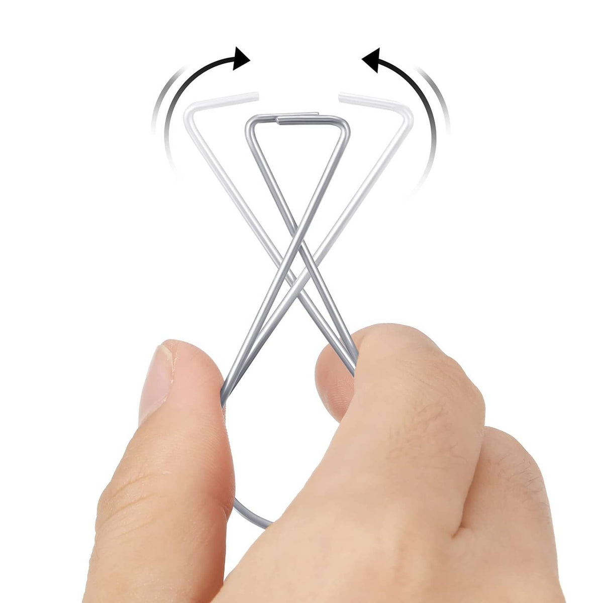Hand holding a silver ceiling hook clip, bending the curved loop ends