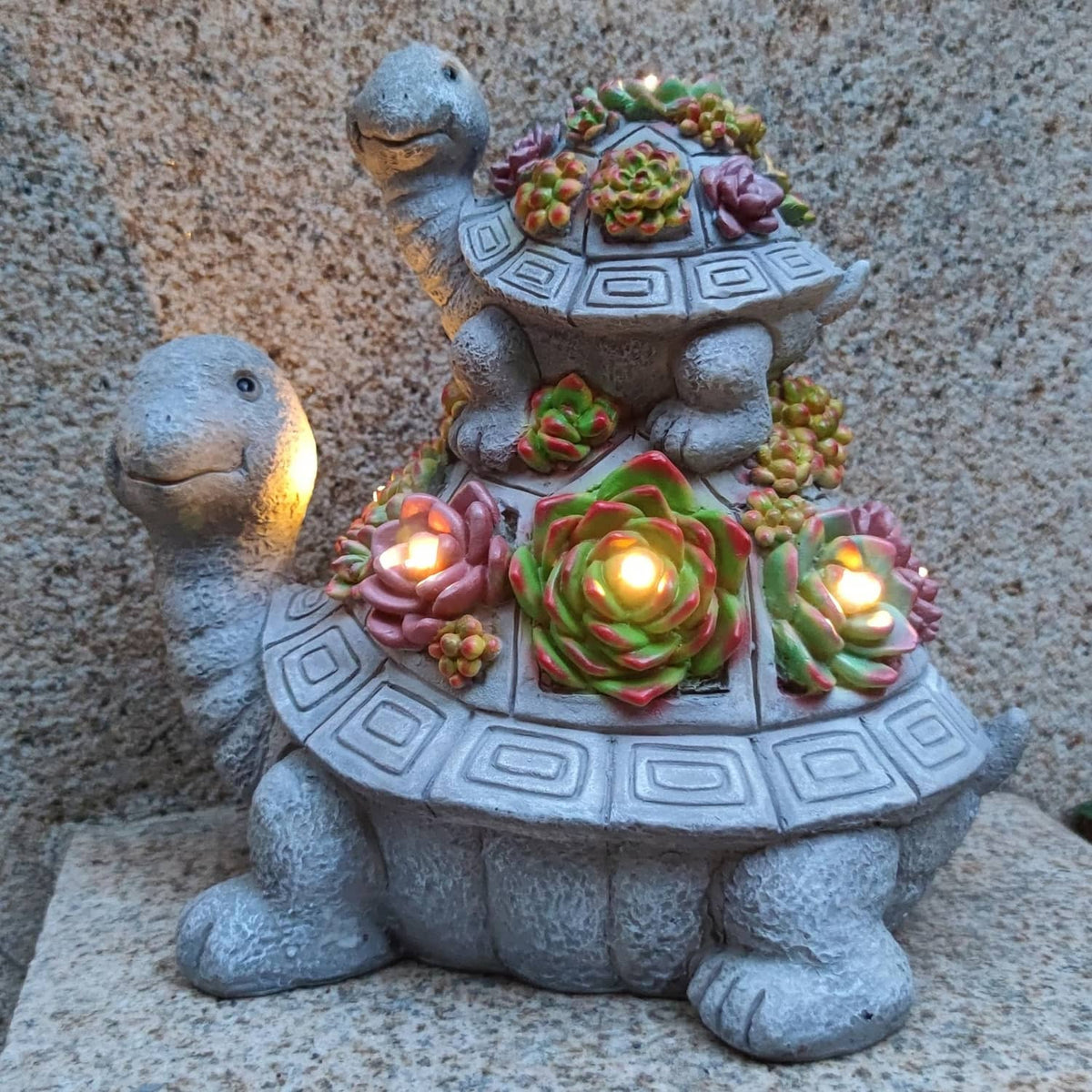 Solar tortoise garden lantern statue with warm glowing LEDs and colorful flower details