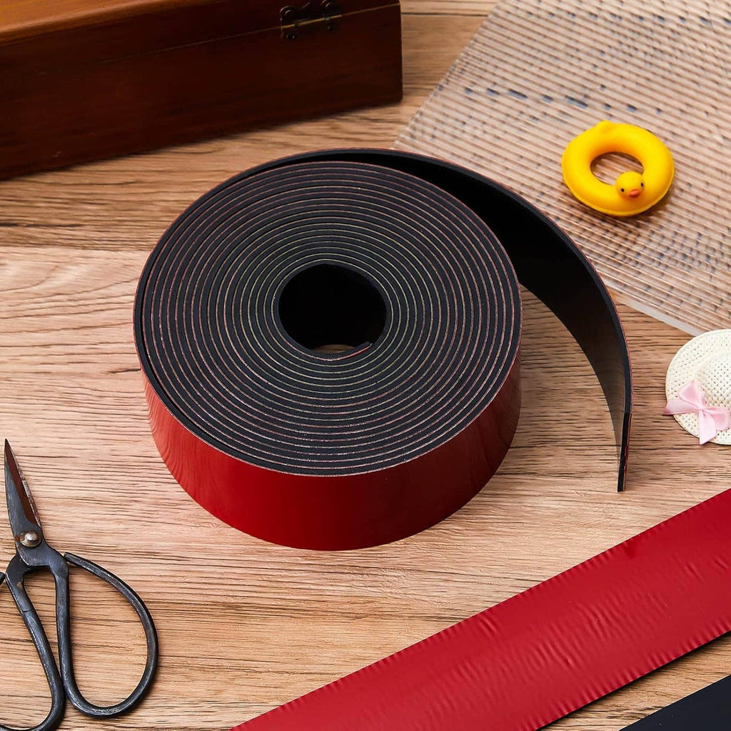 Red keel guard tape roll with black edge on wood surface, tools and fasteners nearby