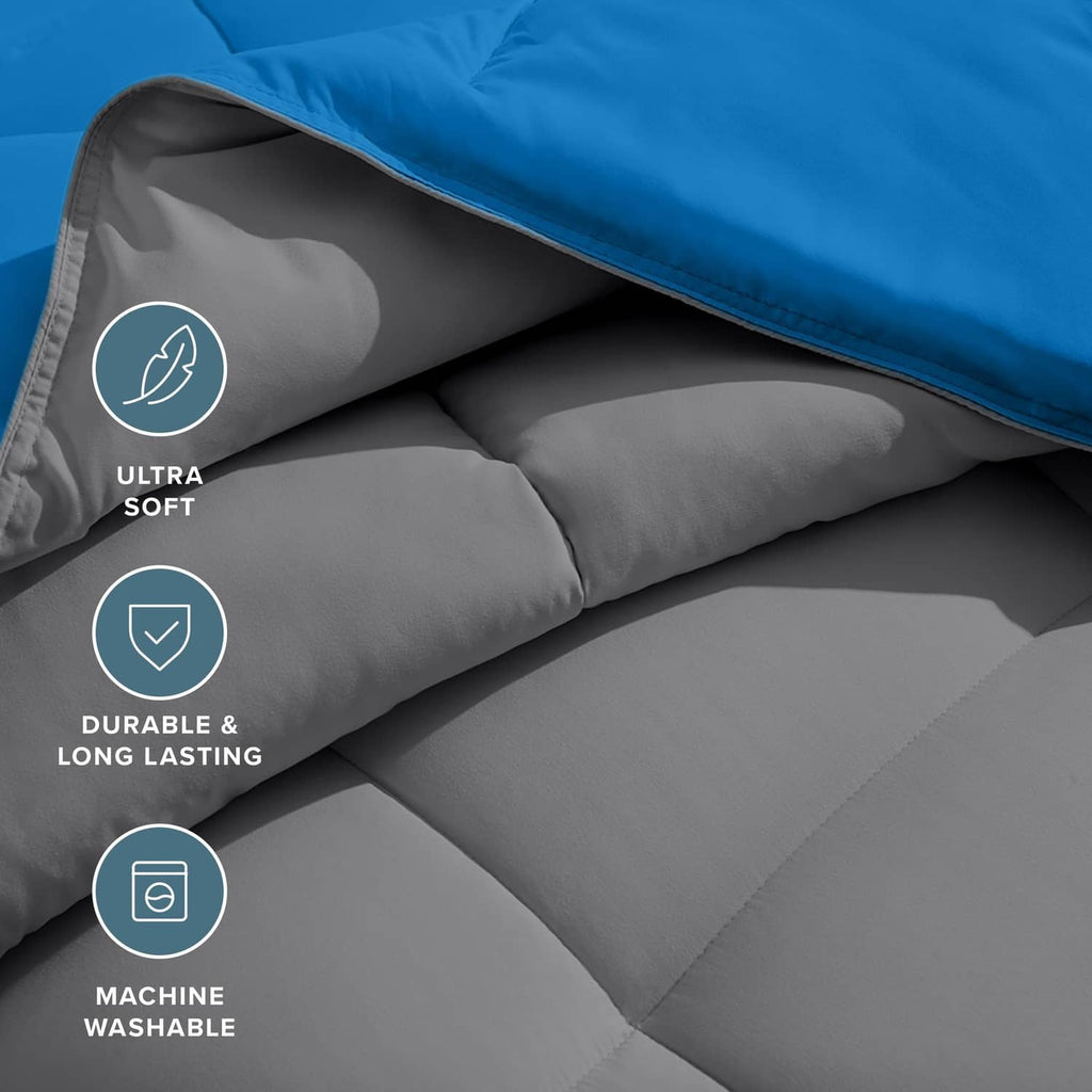 Close-up of reversible comforter underside with grey fabric and blue edge stitching