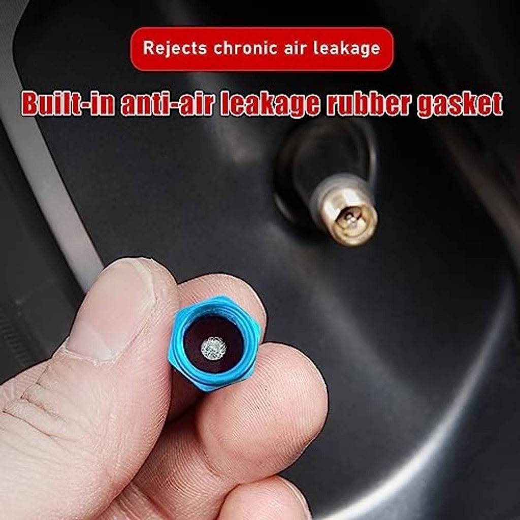 Light blue aluminum valve stem cap held in fingers, hexagon top