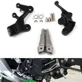 Pair of black motorcycle rider footpeg brackets with textured silver pegs and mounting hardware kit