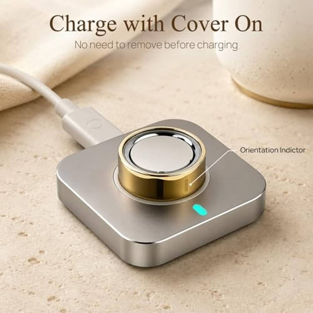 Gold-tone ring cover on charging base, size 8, round metal band