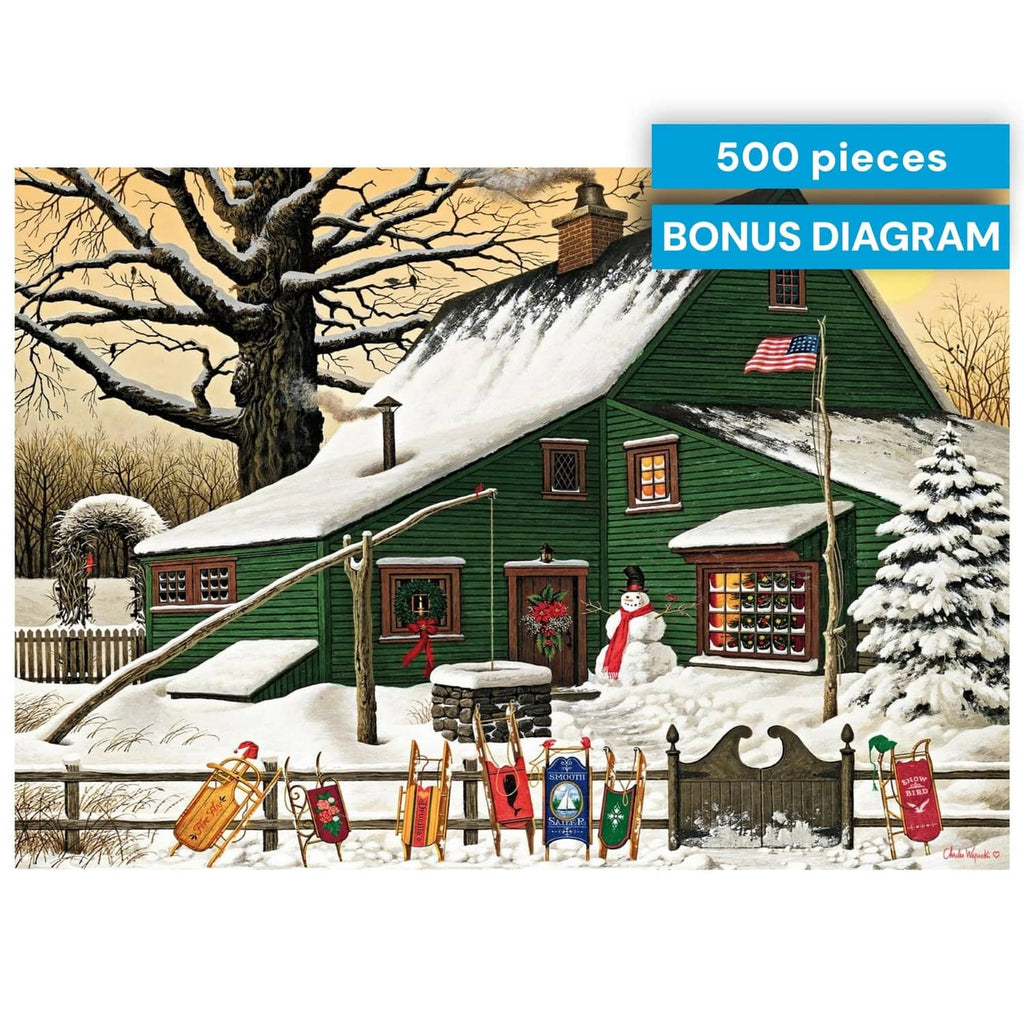 Jigsaw puzzle box front with snowy cabin illustration and 500-piece bonus diagram badge