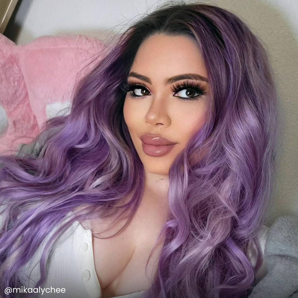 Purple-lavender semi-permanent hair color on long wavy hair, full portrait