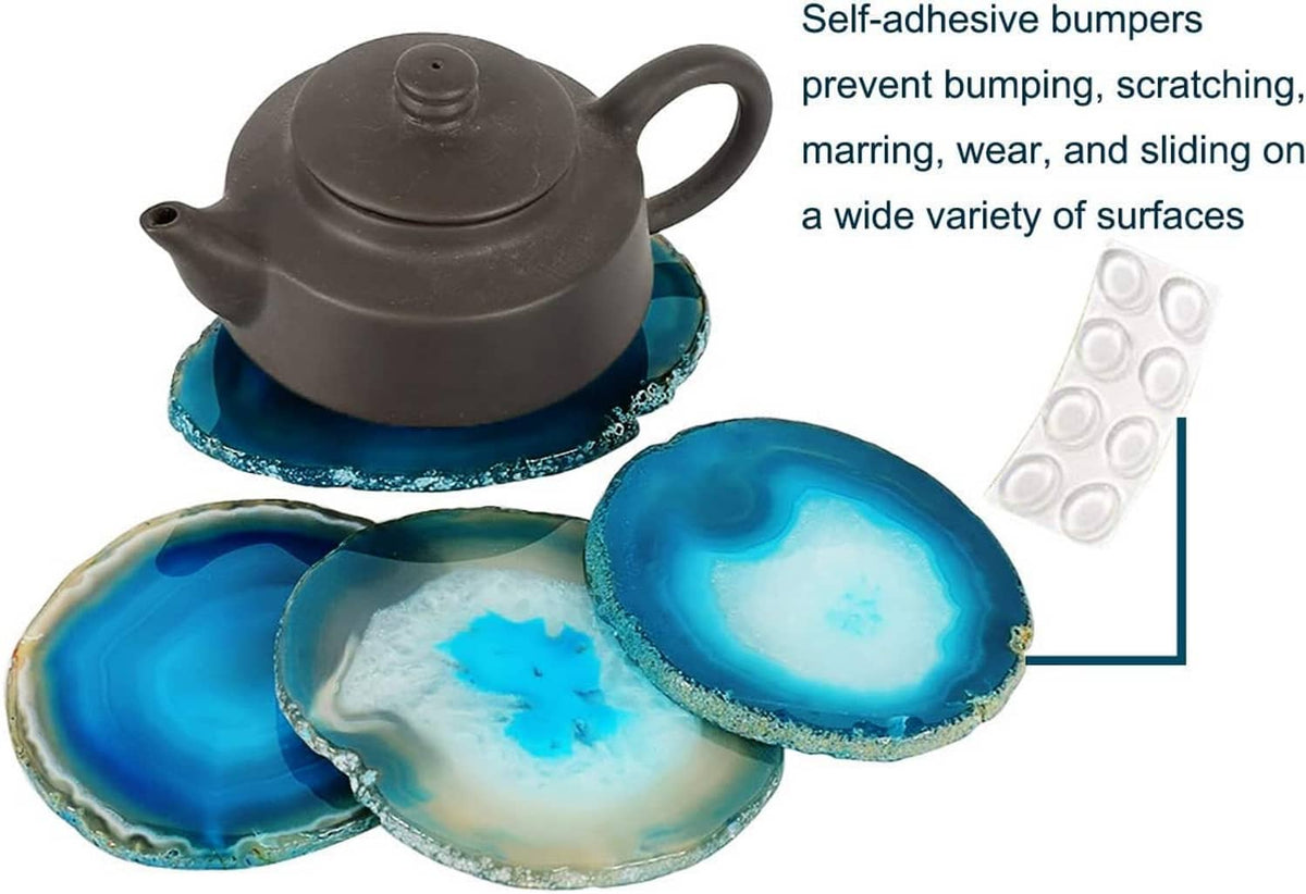 Teal agate geode coasters set with self-adhesive bumpers, beneath a dark teapot