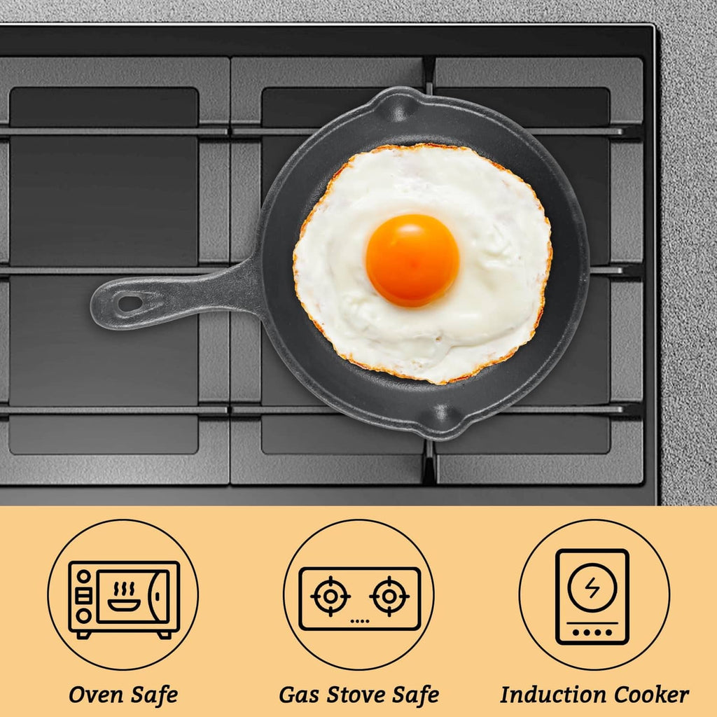 Black mini cast iron skillet with fried egg on grill-style surface