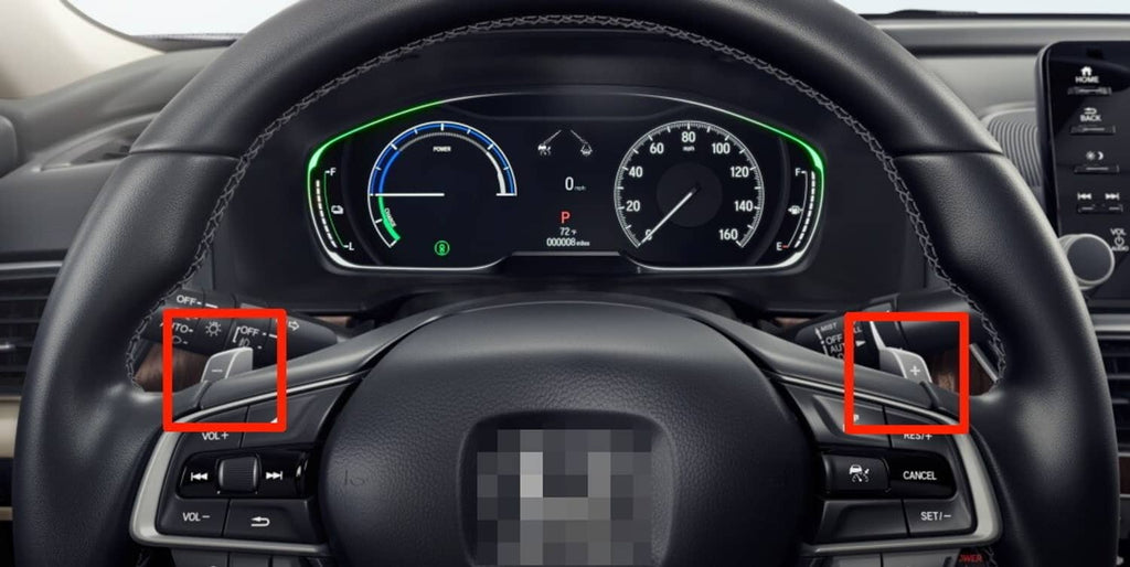 Carbon fiber-style paddle shift covers installed on steering wheel, visible on both sides