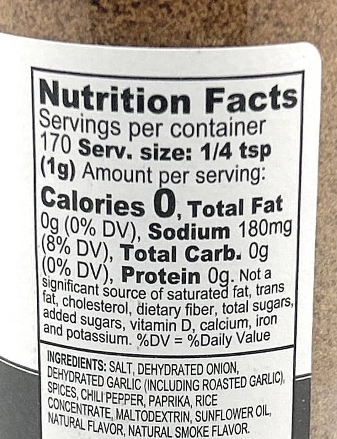 Nutrition Facts label panel on seasoning bottle with serving size and ingredients